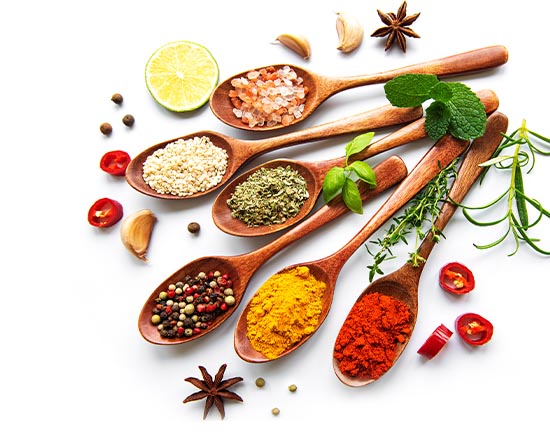 Photo of Indian spices on wooden spoons